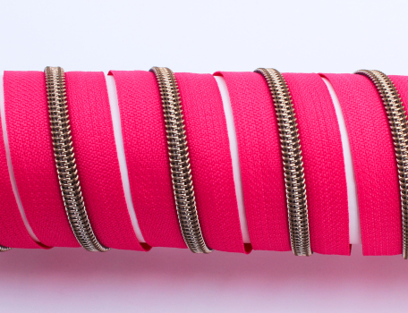 Endlosreißverschluss metallisiert pink/messing-antik (1m)