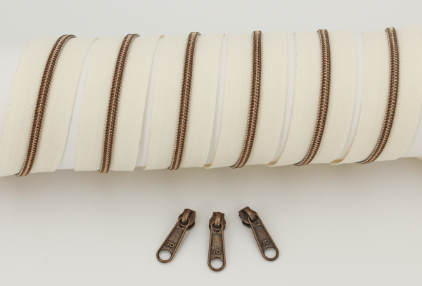 Reißverschluss endlos,  metallisiert schmal naturweiß/messing-antik (1m)